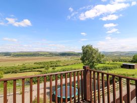 A balcony view overlooking hills and trees at Llwyngwinau Isaf Barn, Tynreithyn near Tregaron