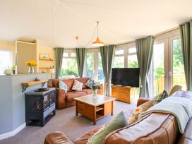 A living room with a sofa and coffee table at Dunromin in Montgomery