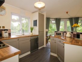 A kitchen with appliances and a window at Dunromin in Montgomery