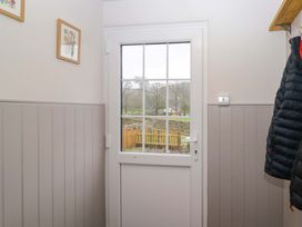 An entryway with a door and coat hanging at Dakota in Boot