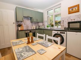 A kitchen with cabinets and appliances at Dakota in Boot