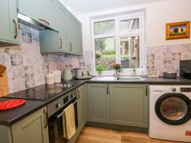 A kitchen with cabinets and appliances at Dakota in Boot