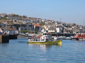 A boat navigating through the harbor at Falmouth Bay 2 in Falmouth