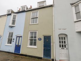 A building with blue and green doors on Hope Street at Harbourside Weymouth