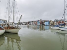 A view of sailboats docked in a harbor at Harbourside in Weymouth