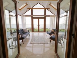 A conservatory with seating and a view at Ard Na Mara, Drung near Quigley's Point, County Donegal
