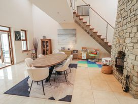 A dining room with a table and chairs at Ard Na Mara in Drung near Quigley's Point, County Donegal