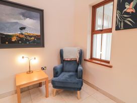 A snug with an armchair and side table at Ard Na Mara Drung near Quigley's Point County Donegal