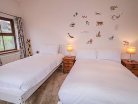 A bedroom with two beds and animal wall decor at Ard Na Mara, Drung near Quigley's Point, County Donegal