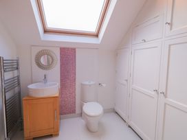 A bathroom with a sink, toilet and a towel radiator at Ard Na Mara in Drung near Quigley's Point, County Donegal
