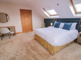 A bedroom with a bed and desk at Ard Na Mara in Drung near Quigley's Point, County Donegal