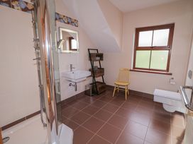 A bathroom with shower, sink, and toilet at Ard Na Mara in Drung near Quigley's Point, County Donegal