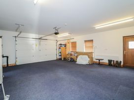 A garage with shelving units and storage boxes at Ard Na Mara in Drung near Quigley's Point, County Donegal