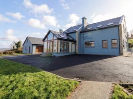An outdoor view of a house with a garage and driveway at Ard Na Mara in Drung near Quigley's Point, County Donegal