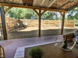 An outdoor area with a table and chairs at Glanrannell Park House in Llanwrda