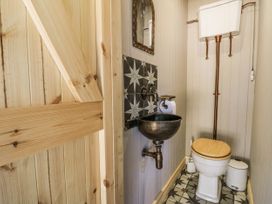 A bathroom with a sink and toilet at Glanrannell Park House Llanwrda