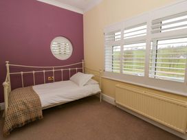 A bedroom with a single bed and radiator at The Retreat at Glanrannell Park House Llansawel