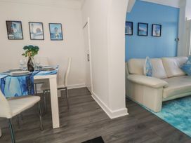 A dining room with a table and chairs at Anfield Stadium House in Liverpool