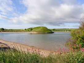A landscape with an island and water at Seafield Granary in Alnmouth