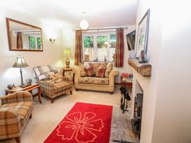 A living room with a sofa and armchairs at Coldbeck Cottage in Ravenstonedale