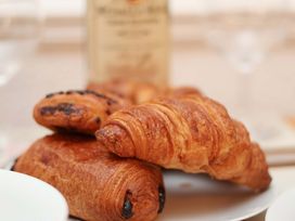 A plate with croissants and pastries at Wayside Farm Dairy Cottage Cloughton near Burniston