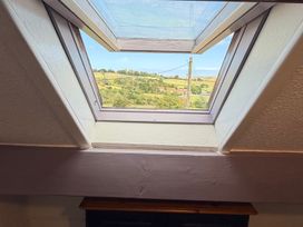 A window with a view of the countryside at Wayside Farm Cart Cottage Cloughton near Burniston