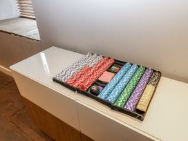 A game tray with poker chips and cards at Mill Race House in Alston