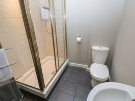 A bathroom with a shower and toilet at Mill Race House Alston