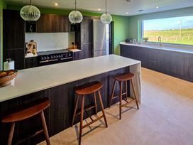 A kitchen with a countertop and appliances at Twyn Isaf in Borth