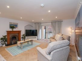 A living room with a fireplace and television at 32 Quay Street Scarborough