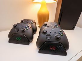 Game controllers on a charging station with a lamp at 32 Quay Street Scarborough