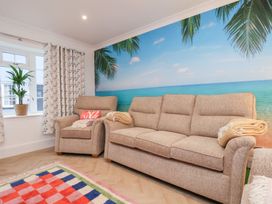 A living room with a sofa and chair at 32 Quay Street in Scarborough