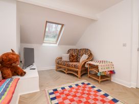 A living room with a sofa and television at 32 Quay Street in Scarborough
