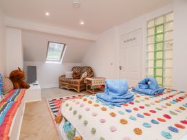 A bedroom with a bed and sofa at 32 Quay Street Scarborough