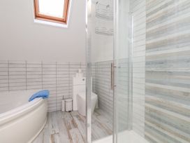 A bathroom featuring a bath tub and shower at 32 Quay Street Scarborough