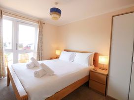 A bedroom with a double bed and bedside table at Boa Vista in Bacton
