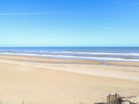 A beach view with water and sand at Boa Vista in Bacton