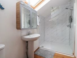 A bathroom with a shower and sink at The Old Vicarage Annex in Hornsea