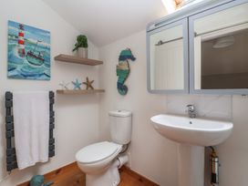 A bathroom with a toilet and sink at The Old Vicarage Annex in Hornsea