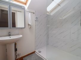 A bathroom with a shower and sink at The Old Vicarage Annex in Hornsea