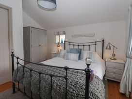 A bedroom with a bed and wardrobe at The Old Vicarage Annex in Hornsea