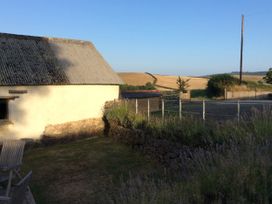 An outdoor area with a building and garden at Westacombe Farm, Dunsford near Tedburn St Mary