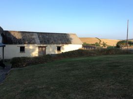 A building with windows and a door outside at Westacombe Farm in Dunsford near Tedburn St Mary