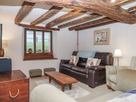 A living room with a sofa and coffee table at Westacombe Farm in Dunsford near Tedburn St Mary