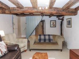A living room with a sofa and armchair at Westacombe Farm in Dunsford near Tedburn St Mary