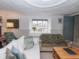 A living room with a sofa and a coffee table at Westacombe Farm in Dunsford