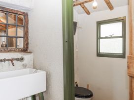 A bathroom with a toilet and a sink at Westacombe Farm in Dunsford