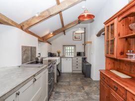 A kitchen with cabinets and appliances at Westacombe Farm in Dunsford