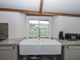 A kitchen with a sink and window at Westacombe Farm in Dunsford