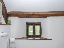 A bathroom with a window and a toilet at Westacombe Farm in Dunsford